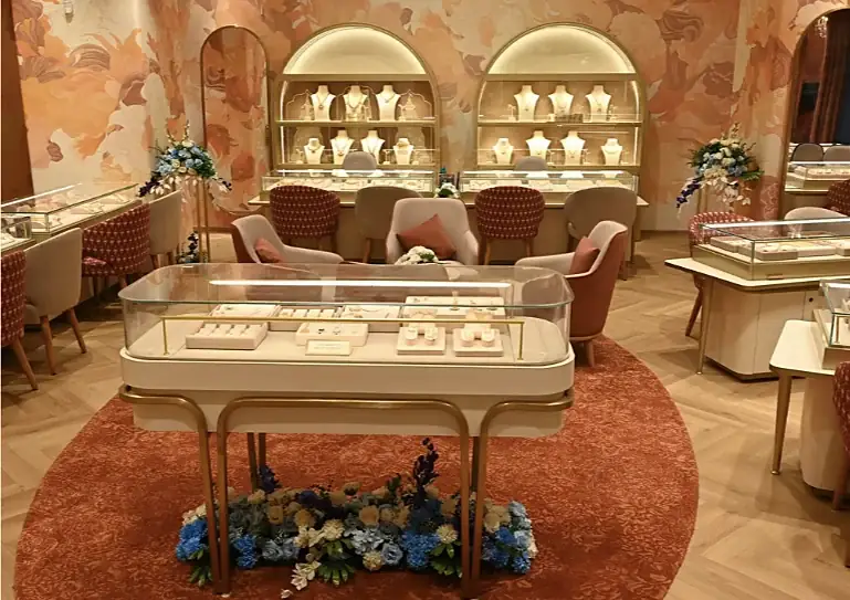 Arched gold display cabinets and a glass jewellery counter at Indriya Andheri West