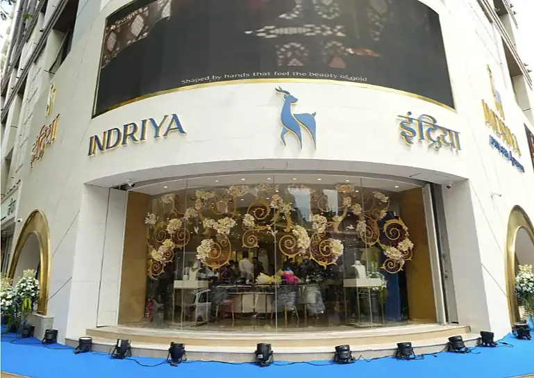 Facade of the Indriya flagship store in Borivali West with the deer logo and floral window display