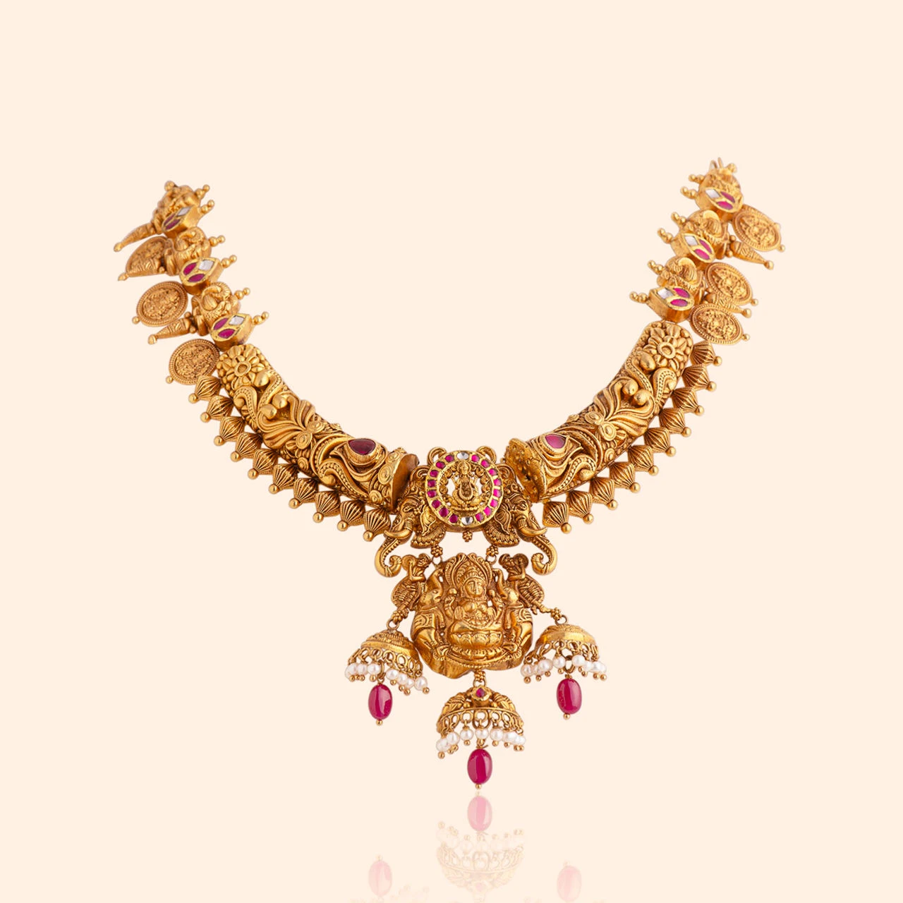 Heirloom Ganesha gold temple necklace from Indriya's Anantara collection, with a deity pendant, ruby drops and pearls