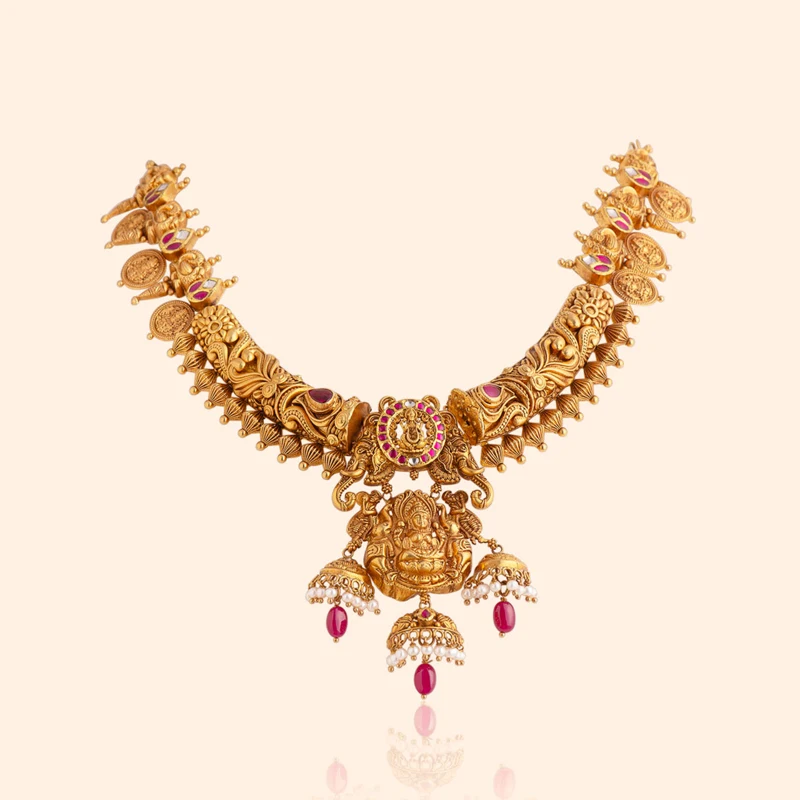 Heirloom Ganesha 22 karat gold bridal necklace with a Lord Ganesha pendant, ruby drops and pearls