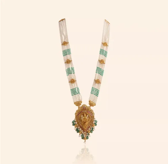 Lakshmi Grace gold bridal necklace with pearl and green bead strands and a Goddess Lakshmi pendant