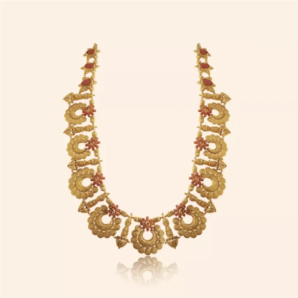 Udaya long gold bridal necklace with sculpted crescent motifs and red stones