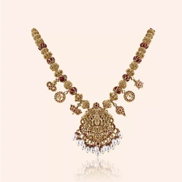 Vishnu Haar short gold necklace with red stone links and a deity pendant with pearl drops